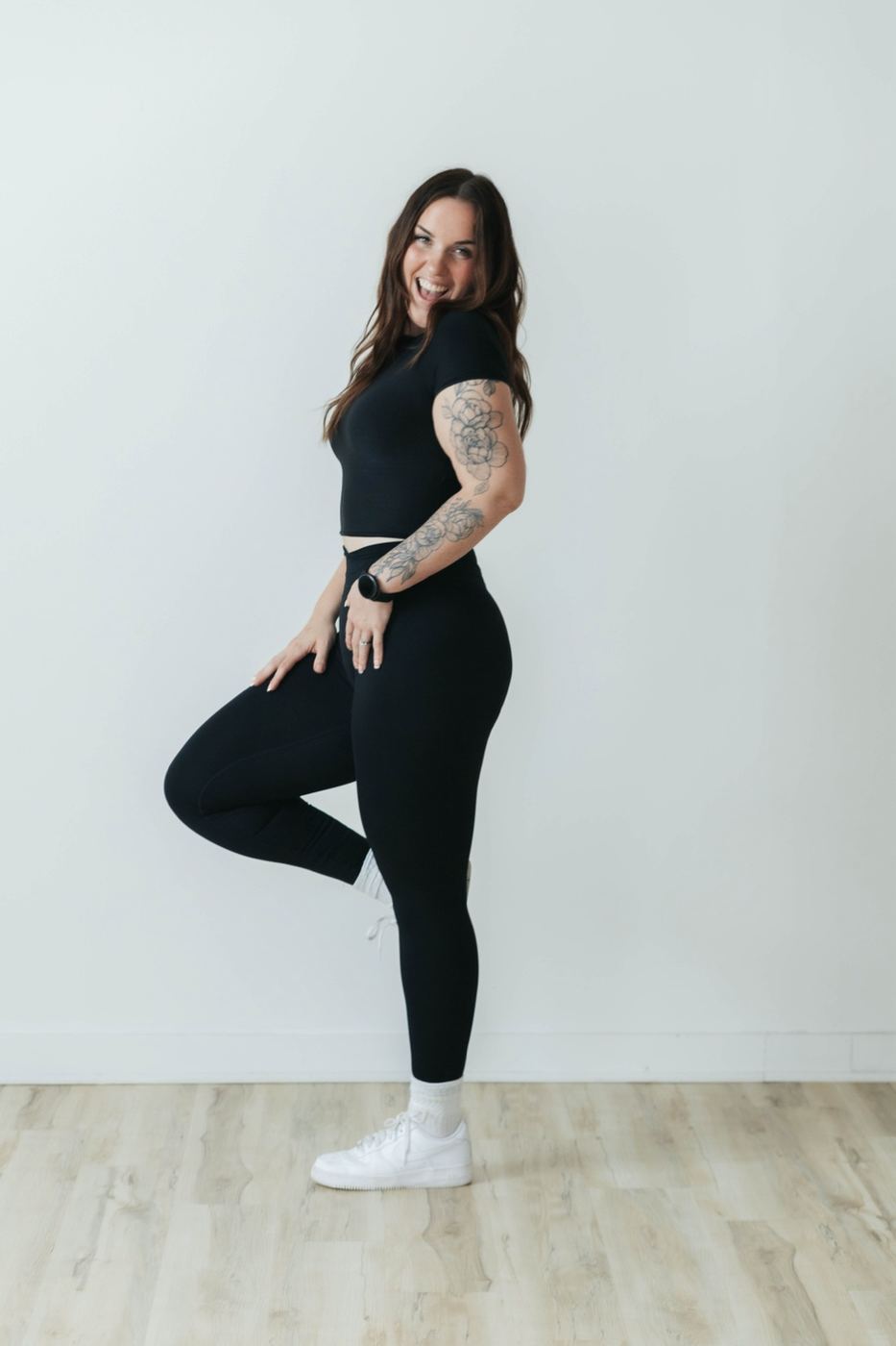 Coach Em standing in a bright studio