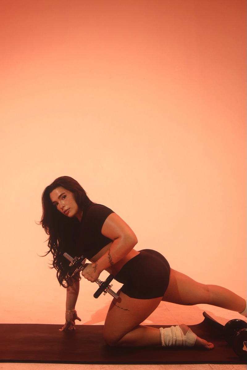 Jaz Margalef mid set with a dumbbell